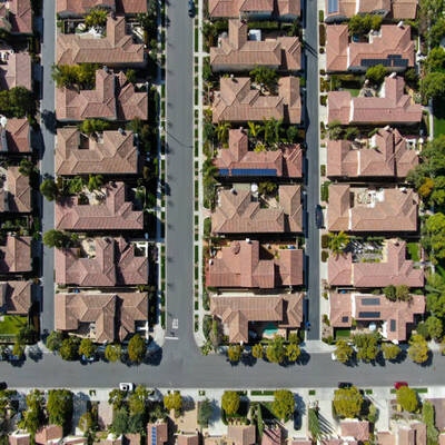 Aerial view suburban neighborhood with identical wealthy villas next to each other. San Diego, California, USA. Aerial view of residential modern subdivision luxury house with swimming pool.